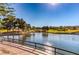 Scenic pond with a waterfall in a beautifully landscaped community with surrounding homes at 10421 Linfield Pl, Las Vegas, NV 89134