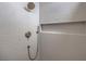 This shower features modern tiles, a rainfall shower head, and a built-in niche at 10421 Linfield Pl, Las Vegas, NV 89134
