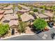 Aerial view of a beautiful home featuring a two car garage and manicured landscaping at 10474 Palmadora St, Las Vegas, NV 89178