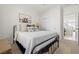Cozy bedroom with comfortable bed, soft textures, and a decorative animal print at 10474 Palmadora St, Las Vegas, NV 89178