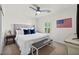 Bright bedroom features a ceiling fan, plantation shutters, and stylish furnishings at 10474 Palmadora St, Las Vegas, NV 89178
