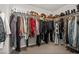 Walk-in closet providing ample storage with shelves and hanging rods for clothes and shoes at 10474 Palmadora St, Las Vegas, NV 89178