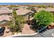 Aerial view of the home showcasing a well kept yard with mature trees at 10474 Palmadora St, Las Vegas, NV 89178