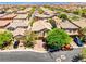 Aerial of the home's exterior showcasing a well manicured lawn and a two car garage at 10474 Palmadora St, Las Vegas, NV 89178