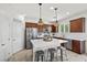 Spacious kitchen with an island, stainless appliances, and a pantry door at 10474 Palmadora St, Las Vegas, NV 89178