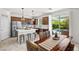 Bright eat-in kitchen featuring a large island, stainless appliances, and outdoor access at 10474 Palmadora St, Las Vegas, NV 89178