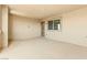 An empty covered outdoor balcony with a window, neutral paint, and a beautiful scenic view at 1103 Tektite Ave, Henderson, NV 89011
