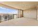 A large, spacious covered outdoor balcony with metal railing and a beautiful scenic view at 1103 Tektite Ave, Henderson, NV 89011