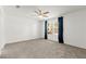 Spacious bedroom with carpet, a ceiling fan, and bright windows at 1103 Tektite Ave, Henderson, NV 89011