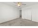 A simple yet cozy bedroom featuring neutral carpet floors, ceiling fan, and double-door closet at 1103 Tektite Ave, Henderson, NV 89011
