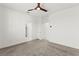 Neutral carpeted bedroom featuring modern ceiling fan and closet access at 1103 Tektite Ave, Henderson, NV 89011