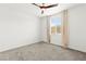A bright, airy bedroom with neutral carpet and a ceiling fan at 1103 Tektite Ave, Henderson, NV 89011