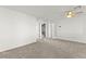 Neutral carpeted bedroom featuring modern ceiling fan and hallway access at 1103 Tektite Ave, Henderson, NV 89011