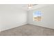 A spacious, brightly lit bedroom featuring carpet floors and a scenic view from the window at 1103 Tektite Ave, Henderson, NV 89011
