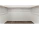 Walk-in closet with ample shelving and neutral carpet at 1103 Tektite Ave, Henderson, NV 89011