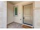 Inviting entryway with a stylish front door, decorative stonework, and a welcoming doormat at 1103 Tektite Ave, Henderson, NV 89011