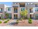 Attractive townhouse featuring stacked stone accents, private balconies, and professional landscaping in a desirable community at 1103 Tektite Ave, Henderson, NV 89011