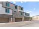 Exterior of townhomes with private garages and brick facades at 1103 Tektite Ave, Henderson, NV 89011