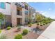 Desirable townhouse with stone accents, balconies, and a well-maintained landscape adding charm to the property at 1103 Tektite Ave, Henderson, NV 89011