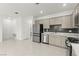 Open kitchen layout with stainless steel appliances and sleek cabinets at 1103 Tektite Ave, Henderson, NV 89011