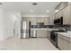 Modern kitchen with stainless steel appliances and stylish backsplash at 1103 Tektite Ave, Henderson, NV 89011