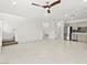 Spacious living room featuring tile floors, leading to an open staircase at 1103 Tektite Ave, Henderson, NV 89011