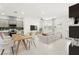 Spacious living area seamlessly connects to the modern kitchen, featuring an island and a comfortable seating arrangement at 1103 Tektite Ave, Henderson, NV 89011
