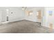 Spacious living area with plush carpet, fan, and natural light at 1103 Tektite Ave, Henderson, NV 89011