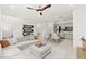 Bright, open-concept living and dining area with a modern ceiling fan, neutral tones, and easy access to the kitchen at 1103 Tektite Ave, Henderson, NV 89011