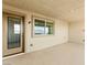 Covered patio area with neutral colors, ready for personalization and relaxation at 1103 Tektite Ave, Henderson, NV 89011