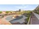 Community play area featuring play equipment and desert landscaping at 1103 Tektite Ave, Henderson, NV 89011
