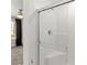 Modern glass enclosed shower with built in seat and rainfall showerhead at 1103 Tektite Ave, Henderson, NV 89011
