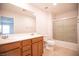 Bathroom featuring double sink vanity, tile flooring, and glass enclosed shower at 11044 Camden Bay St, Las Vegas, NV 89179