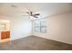 Bright bedroom with neutral carpet, ceiling fan, and adjacent bathroom at 11044 Camden Bay St, Las Vegas, NV 89179