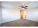 Spacious bedroom featuring neutral carpet, ceiling fan, and two closets at 11044 Camden Bay St, Las Vegas, NV 89179