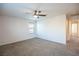 Bright bedroom with plush carpet, ceiling fan, and large window at 11044 Camden Bay St, Las Vegas, NV 89179