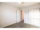 Carpeted bedroom featuring bright light, a closet, and a door with access to other rooms at 11044 Camden Bay St, Las Vegas, NV 89179