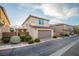 Charming two-story home with a well-maintained lawn, brick perimeter and attached two-car garage at 11044 Camden Bay St, Las Vegas, NV 89179