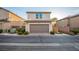 Inviting home featuring a two-car garage, well-manicured landscaping, and a cozy curb appeal at 11044 Camden Bay St, Las Vegas, NV 89179
