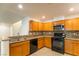 Well-equipped kitchen featuring granite counters, a tile backsplash, and modern appliances at 11044 Camden Bay St, Las Vegas, NV 89179