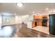 Bright kitchen with stainless steel appliances, granite counters, and an open view to the living room at 11044 Camden Bay St, Las Vegas, NV 89179