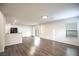 Spacious living room with wood-look flooring and recessed lighting. Sliding door access to the yard at 11044 Camden Bay St, Las Vegas, NV 89179