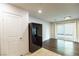 Bright living area with modern floors, neutral paint, and sliding door access to outdoor space at 11044 Camden Bay St, Las Vegas, NV 89179