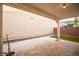 Covered patio with stone pavers and brick privacy wall at 11044 Camden Bay St, Las Vegas, NV 89179