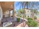 Backyard with a covered patio, lush landscaping, and brick pavers at 1554 Ward Frontier Ln, Henderson, NV 89002