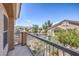 Balcony view showcasing the neighborhood's well-maintained streets and picturesque homes under a sunny sky at 1554 Ward Frontier Ln, Henderson, NV 89002