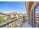 Balcony view offers a serene perspective of the neighborhood's charming homes and lush greenery at 1554 Ward Frontier Ln, Henderson, NV 89002