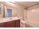 Bathroom featuring a vanity, toilet, and shower-tub combo, offering essential amenities at 1554 Ward Frontier Ln, Henderson, NV 89002