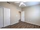 Cozy bedroom with wood-look floors, closet, and an open doorway at 1554 Ward Frontier Ln, Henderson, NV 89002