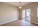 Bright dining area featuring tiled floors and a sliding door leading to an outdoor patio at 1554 Ward Frontier Ln, Henderson, NV 89002